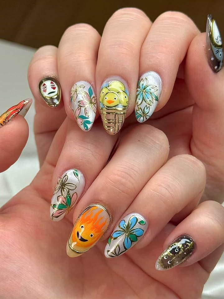 Studio Ghibli themed nails featuring No-Face, Calcifer, Totoro, and characters from Ponyo and Spirited Away