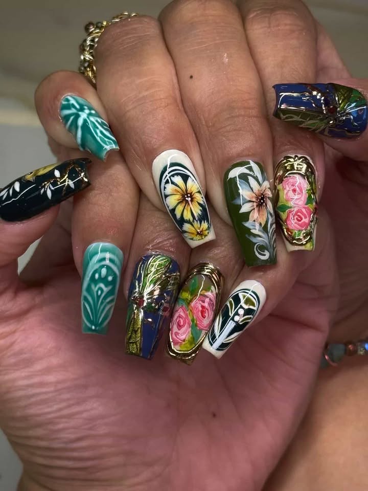 Long coffin nails with tropical green florals and roses on gold backdrops